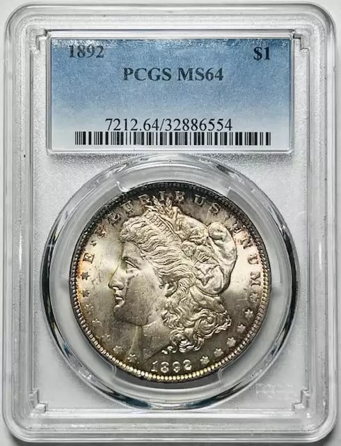 1892 P Morgan Silver Dollar PCGS MS64 Uncirculated Silver Coin: 1892 P Morgan Silver Dollar PCGS MS64 Uncirculated Silver Coin This 1892 P Morgan Silver Dollar is certified by PCGS with a grade of MS 64, indicating it is in uncirculated condition. Struck at the Ph