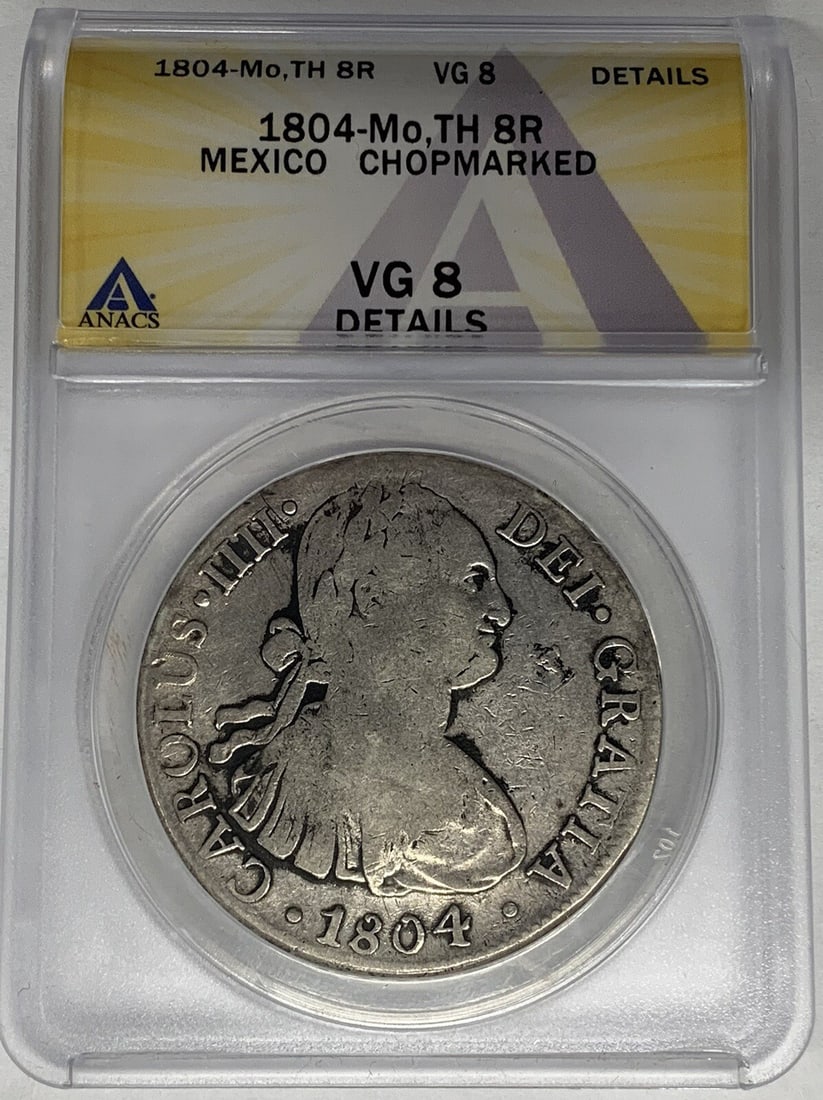 Chopmarked 1804 Mexico 8 Reales Silver Coin ANACS VG 8 Certified: Chopmarked 1804 Mexico 8 Reales Silver Coin ANACS VG 8 Certified This 1804-Mo, TH 8 Reales coin from Mexico is crafted from silver and originates from the colonial period, prior to 1821. It is chopmar