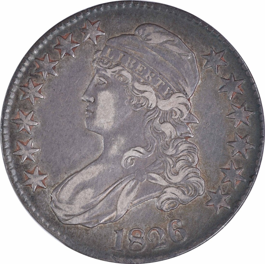 1826 Bust Half Dollar John Reich 50C Uncertified Silver Coin: 1826 Bust Half Dollar John Reich 50C Uncertified Silver Coin This 1826 Bust Half Dollar offers a glimpse into early American coinage, featuring a design by John Reich. Struck at the Philadelphia Mint,