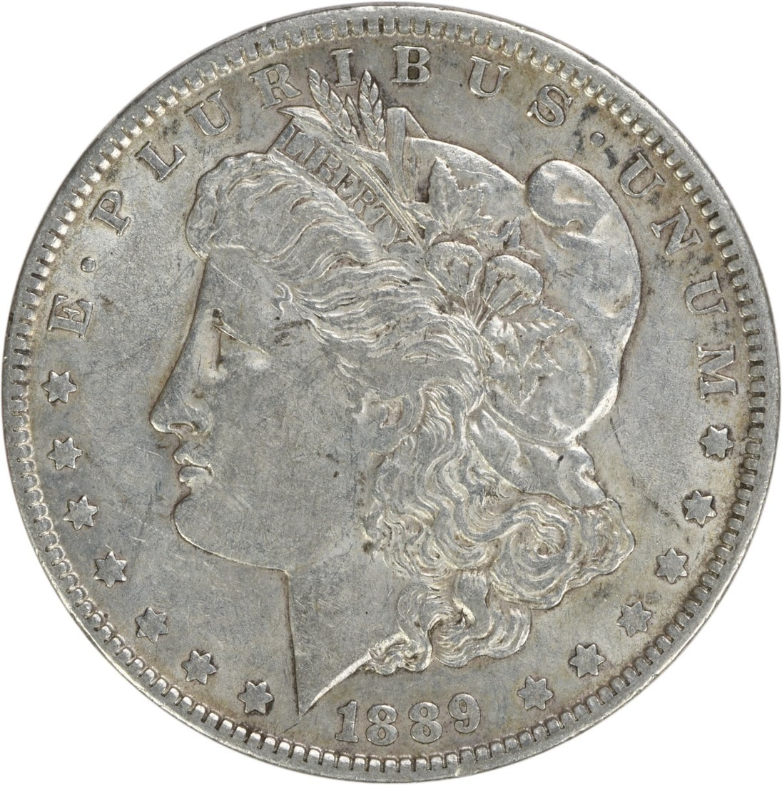 1889-O Morgan Silver Dollar EF Uncertified New Orleans Coin: 1889-O Morgan Silver Dollar EF Uncertified New Orleans Coin This 1889-O Morgan Silver Dollar is an exquisite representation of American coinage, featuring a design by renowned engraver George T. Morga