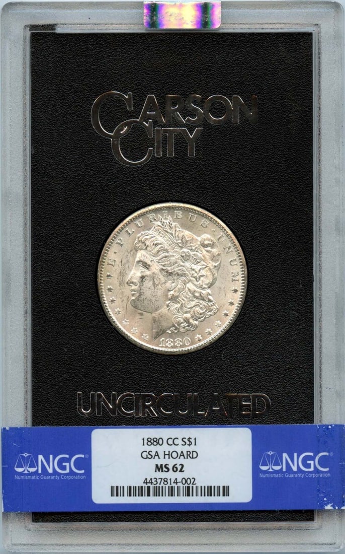 1880-CC Morgan Dollar NGC MS62 GSA Hoard with Reverse Toning: 1880-CC Morgan Dollar NGC MS62 GSA Hoard with Reverse Toning This 1880-CC Morgan Dollar is a remarkable piece from the GSA hoard, certified by NGC with a grade of MS62. Struck at the Carson City mint,