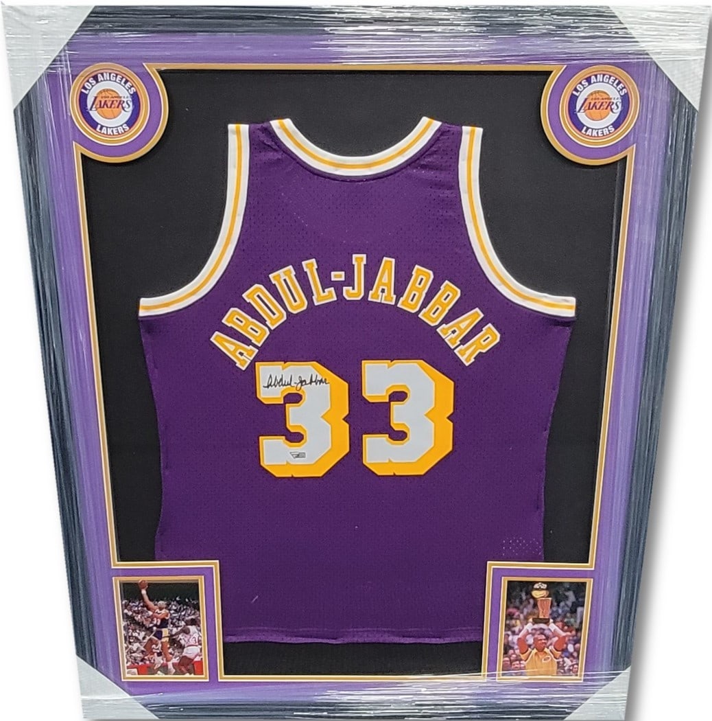 Kareem Abdul-Jabbar Signed Framed Jersey 35x44 Lakers Fanatics Authentic: Kareem Abdul-Jabbar Signed Framed Jersey 35x44 Lakers Fanatics Authentic Celebrate the legacy of basketball legend Kareem Abdul-Jabbar with this stunning autographed framed jersey. This original Los A