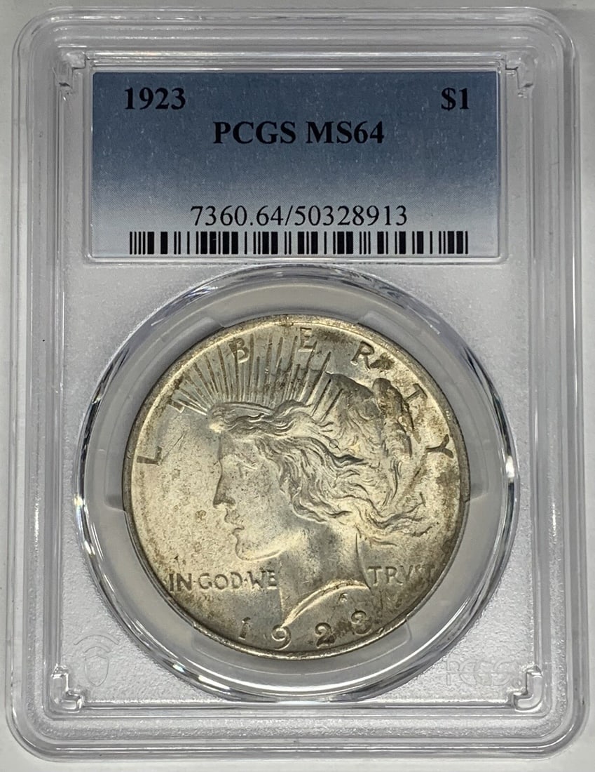 1923 Peace Dollar Silver Coin PCGS MS64 Lightly Toned Example: 1923 Peace Dollar Silver Coin PCGS MS64 Lightly Toned Example This 1923 Peace Silver Dollar coin features a lightly toned appearance and has been graded MS 64 by PCGS. It is an uncirculated coin compo