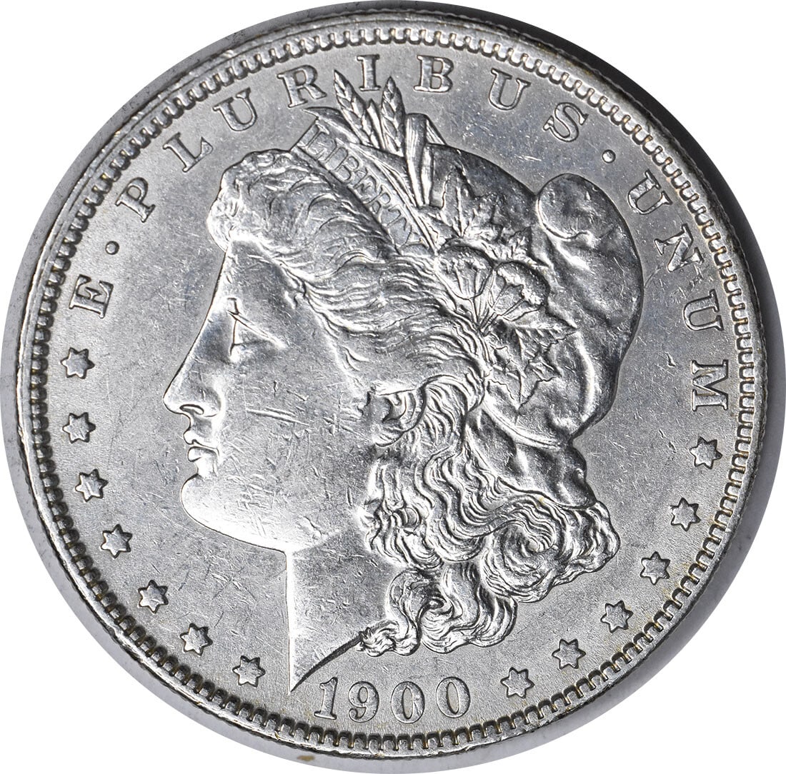 1900 O Over CC Morgan Silver Dollar AU Grade Uncertified: 1900 O Over CC Morgan Silver Dollar AU Grade Uncertified This is a 1900-O/CC Morgan Silver Dollar originating from the United States. The coin is of the Morgan variety, with a denomination of $1. It i