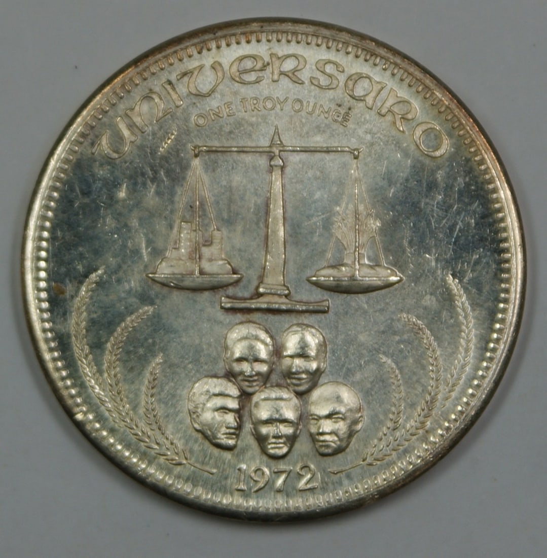 One Troy Ounce Universaro .999 Silver Round with Toning and Handling Marks: One Troy Ounce Universaro .999 Silver Round with Toning and Handling Marks This Universaro "One Silver" round contains 1 troy ounce of .999 pure silver. The round is uncirculated but displays handling