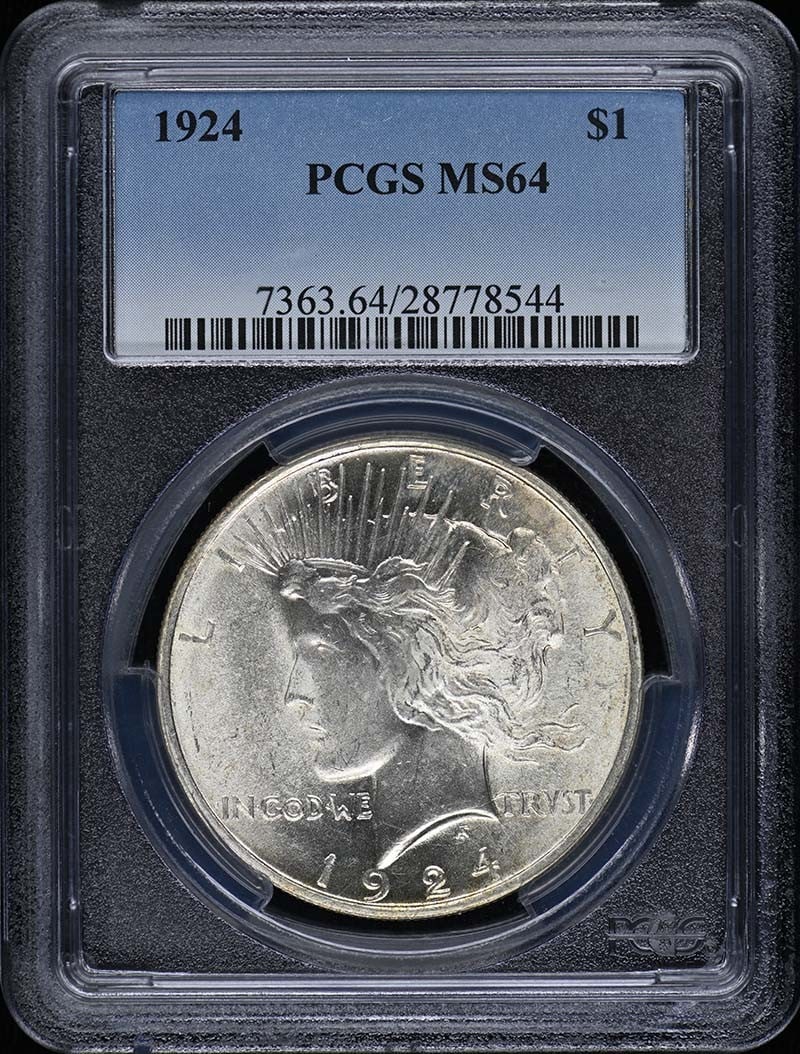 1924 Peace Dollar Silver Coin Graded MS64 by PCGS: 1924 Peace Dollar Silver Coin Graded MS64 by PCGS This 1924 Peace Dollar is graded MS64 and certified by PCGS. Struck at the Philadelphia Mint, this uncirculated coin is a pre-owned piece and features