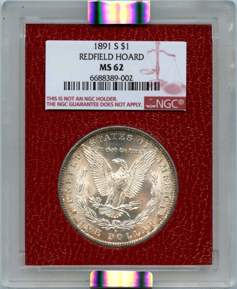 1891-S Morgan Dollar Redfield Hoard NGC MS62 Uncirculated: 1891-S Morgan Dollar Redfield Hoard NGC MS62 Uncirculated This 1891-S Morgan Dollar $1 is a remarkable piece from the Redfield Hoard, certified by NGC with a grade of MS62, indicating its uncirculated