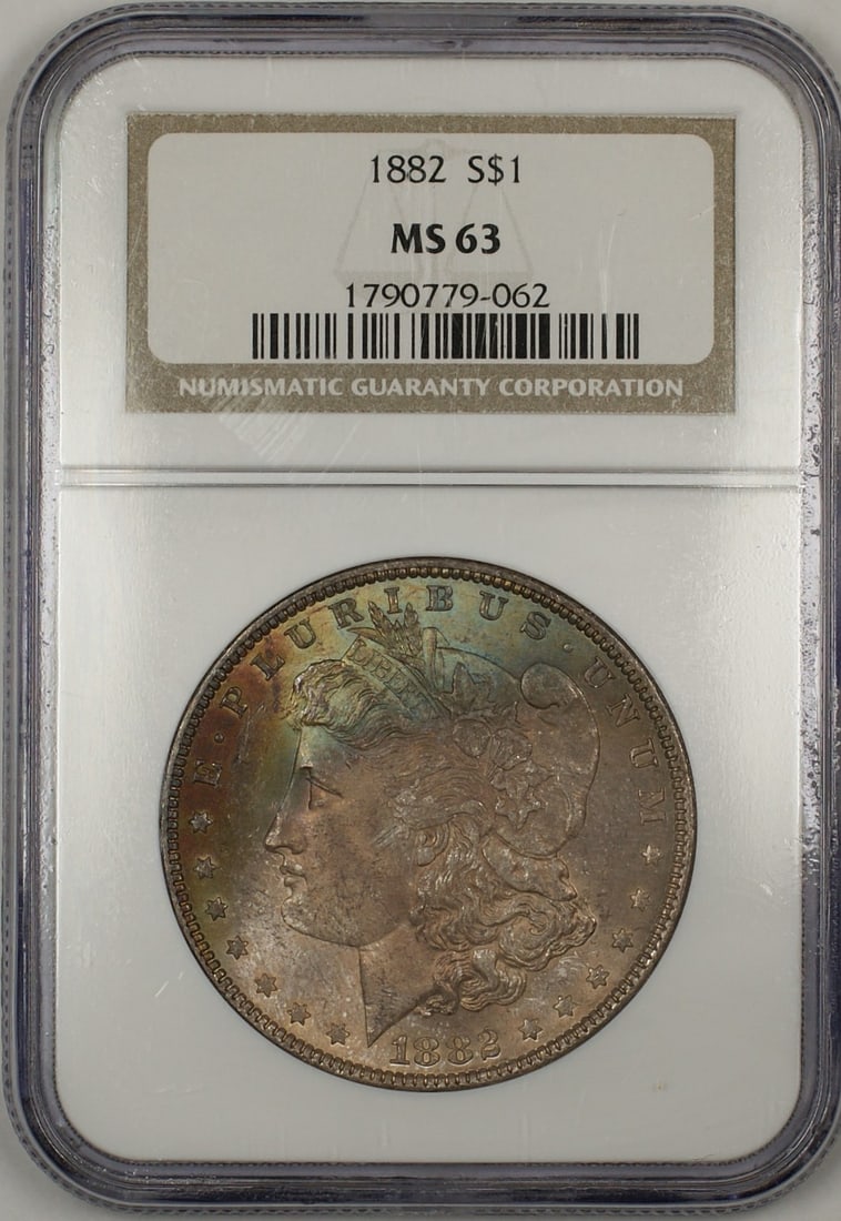 NGC MS 63 1882 Silver Morgan Dollar Philadelphia Nicely Toned: NGC MS 63 1882 Silver Morgan Dollar Philadelphia Nicely Toned This 1882 Morgan Silver Dollar features attractive toning and has been graded MS-63 by NGC. Struck in Philadelphia, this uncirculated coin