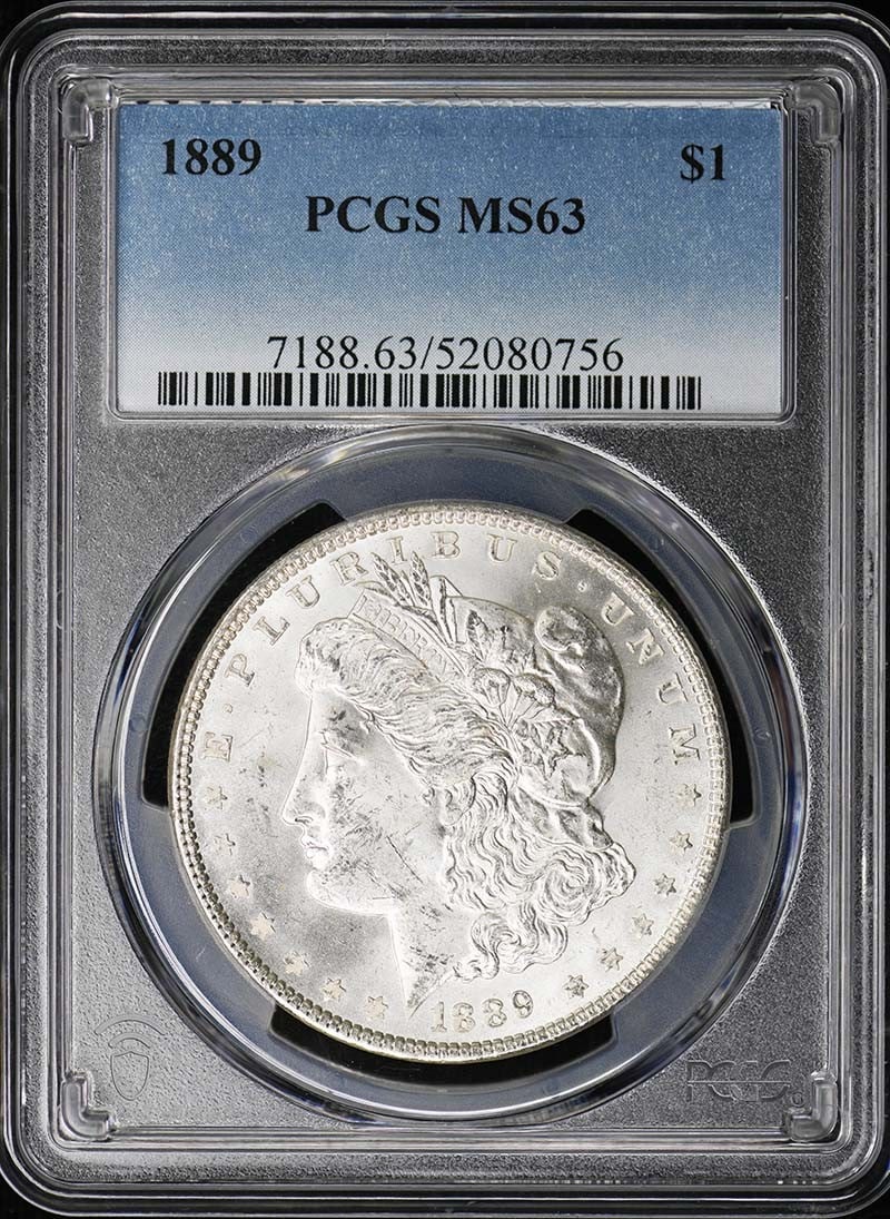 PCGS MS63 1889 Morgan Silver Dollar Uncirculated Philadelphia: PCGS MS63 1889 Morgan Silver Dollar Uncirculated Philadelphia This is an 1889 Morgan Dollar graded MS63 by PCGS. The coin is uncirculated and was minted in Philadelphia. It features the classic Morgan