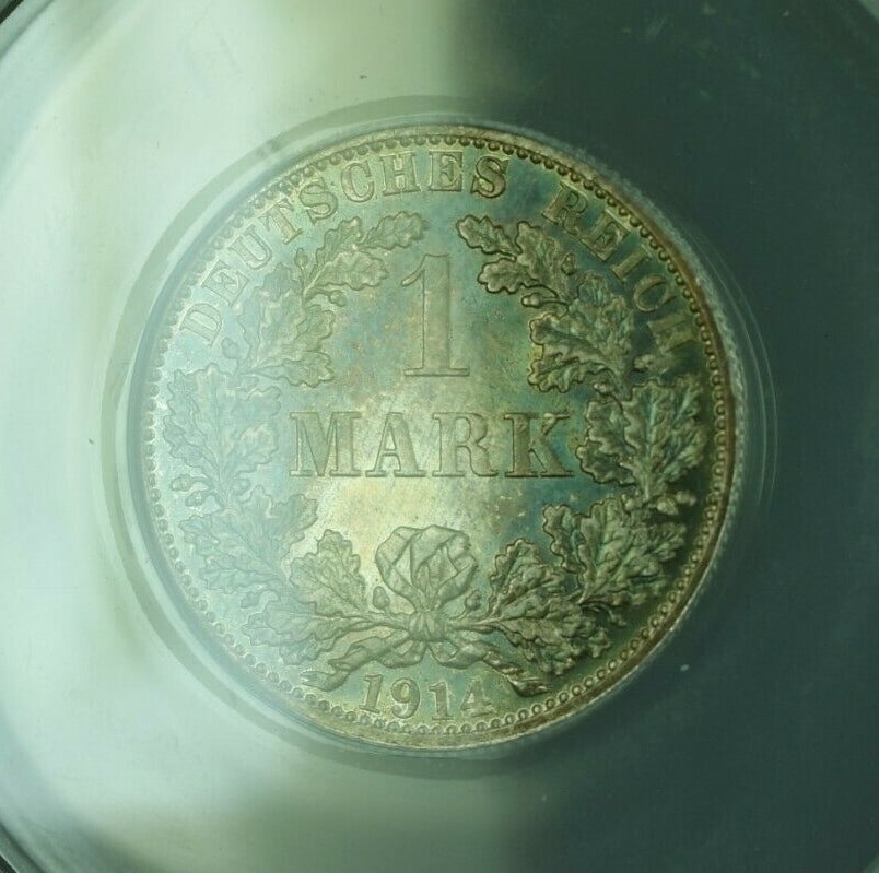 Germany 1914-A 1 Mark Silver Coin ANACS AU-55 with Attractive Toning: Germany 1914-A 1 Mark Silver Coin ANACS AU-55 with Attractive Toning This is a 1914-A 1 Mark silver coin from Germany, certified by ANACS with a grade of AU-55. The coin is uncirculated and features a