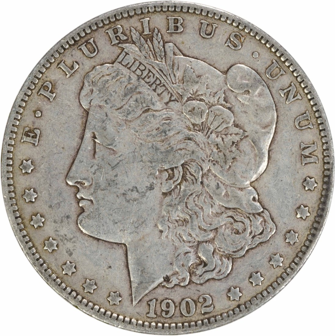 1902 Morgan Silver Dollar EF Uncertified 90% Silver Coin: 1902 Morgan Silver Dollar EF Uncertified 90% Silver Coin This 1902 Morgan Silver Dollar is a classic piece of American numismatics, featuring the renowned design by George T. Morgan. The coin is in ci