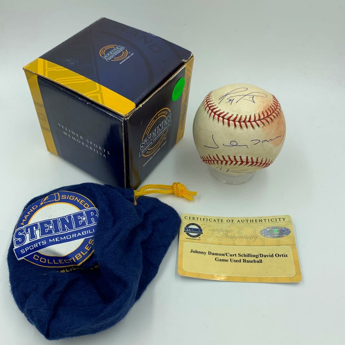 2004 ALCS Game Used Baseball Signed by Ortiz Schilling Damon Steiner Authenticated: 2004 ALCS Game Used Baseball Signed by Ortiz Schilling Damon Steiner Authenticated This historic 2004 ALCS game-used baseball features the signatures of three prominent players: David Ortiz, Curt Schi