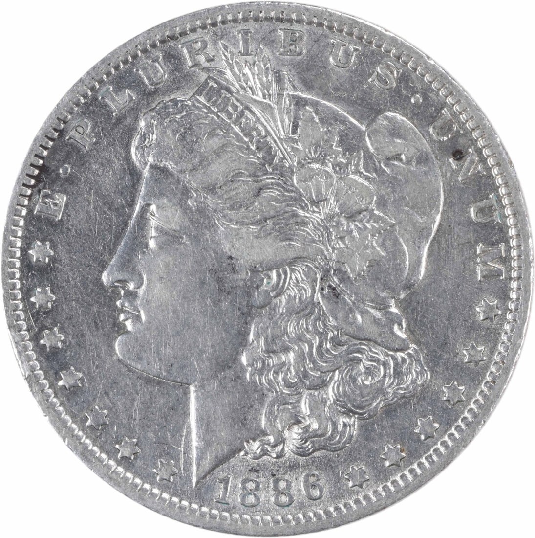 1886-O Morgan Silver Dollar 90% Silver XF Uncertified Coin: 1886-O Morgan Silver Dollar 90% Silver XF Uncertified Coin This 1886-O Morgan Silver Dollar is a classic piece of American numismatics. Struck in New Orleans, this coin features the iconic design by G