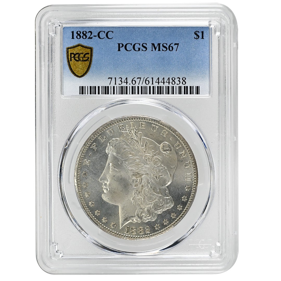 PCGS MS67 Carson City 1882 Morgan Silver Dollar Certified Rare Coin: PCGS MS67 Carson City 1882 Morgan Silver Dollar Certified Rare Coin This is an 1882-CC Morgan Dollar graded MS67 by PCGS, featuring clean white surfaces and a clean cheek. Struck at the Carson City Mi