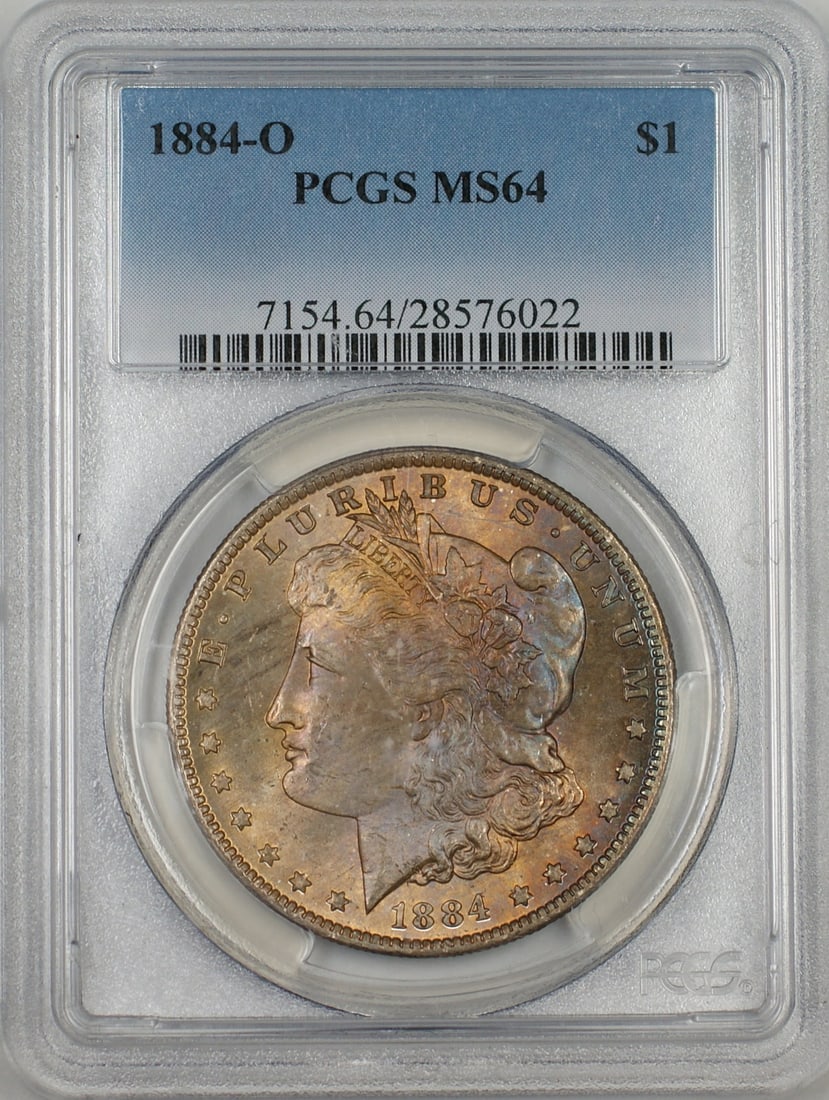 PCGS MS64 1884-O Silver Dollar with Attractive Obverse Toning: PCGS MS64 1884-O Silver Dollar with Attractive Obverse Toning This 1884-O Morgan Silver Dollar is certified by PCGS with a grade of MS 64. The coin features a beautifully toned obverse and was minted
