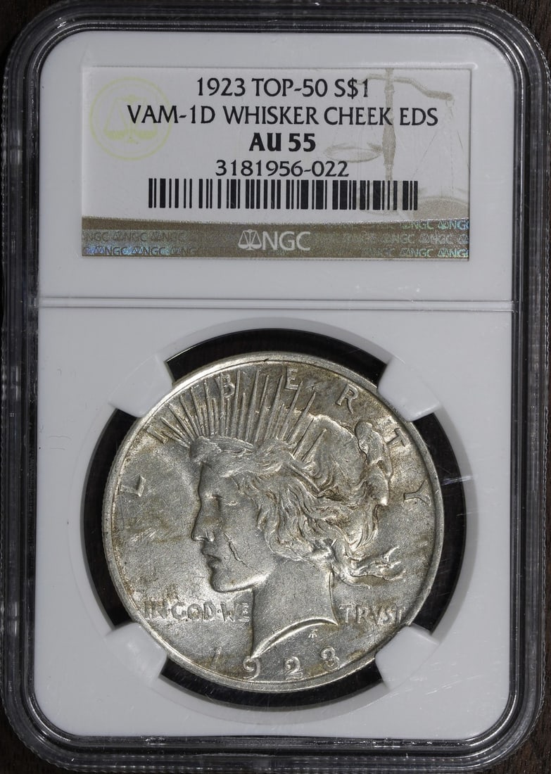 1923 Peace Silver Dollar AU55 NGC VAM 1-D Whisker Cheek: 1923 Peace Silver Dollar AU55 NGC VAM 1-D Whisker Cheek This 1923 Peace Silver Dollar is a remarkable coin in AU 55 condition, showcasing the classic design that symbolizes peace. Minted in Philadelph