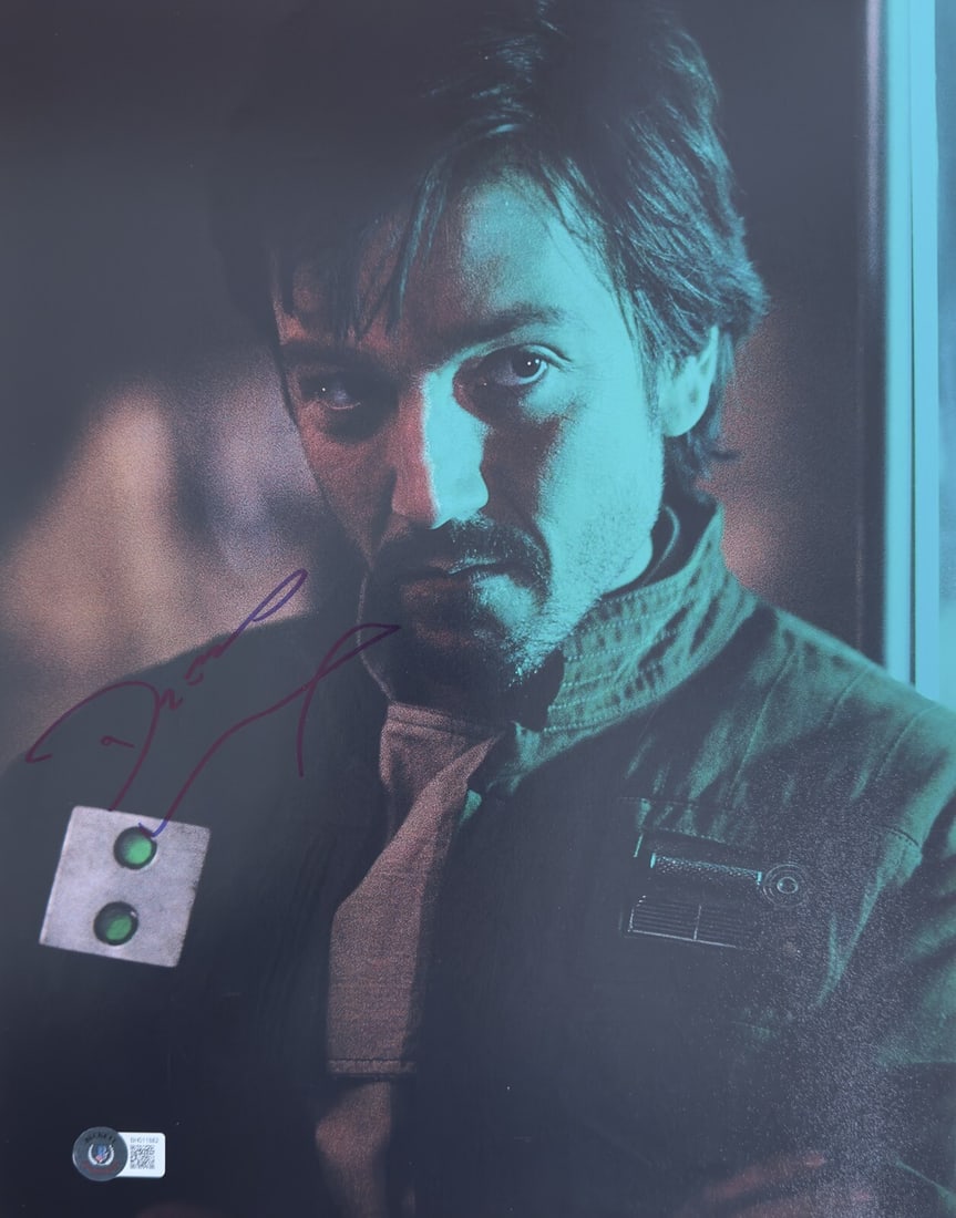 Autographed 11x14 Photo of Diego Luna as Cassian Andor Beckett Authenticated: Autographed 11x14 Photo of Diego Luna as Cassian Andor Beckett Authenticated This is an autographed 11x14 photograph featuring Diego Luna as Cassian Andor from "Rogue One: A Star Wars Story." The phot