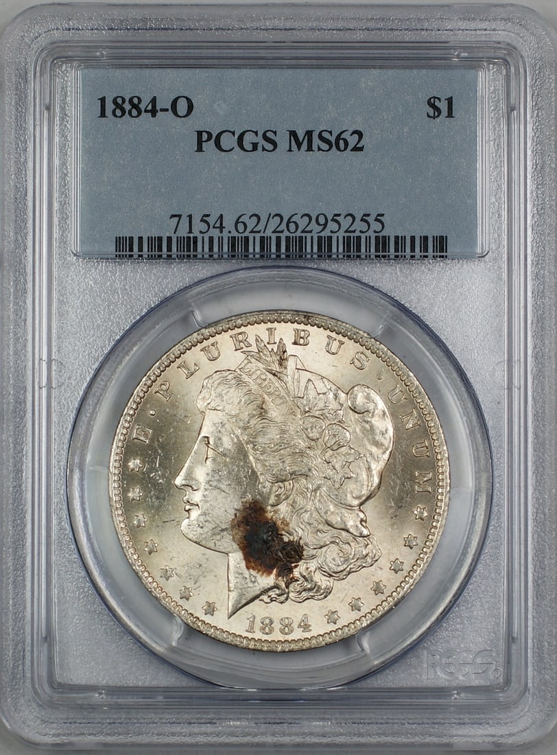 PCGS MS62 1884-O Morgan Dollar Silver Coin from New Orleans Mint: PCGS MS62 1884-O Morgan Dollar Silver Coin from New Orleans Mint This is an 1884-O Morgan Silver Dollar $1 coin, certified by PCGS with a grade of MS 62. Minted in New Orleans, the coin is composed of
