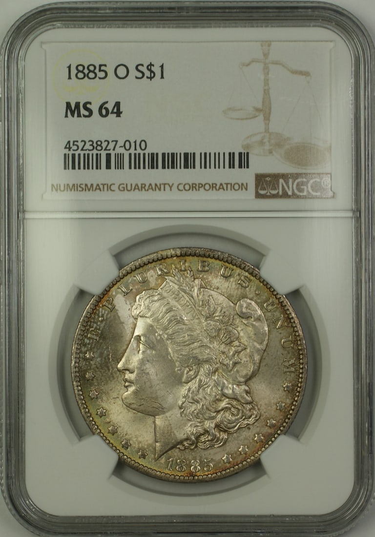 NGC MS 64 1885-O Morgan Dollar Silver Coin with Attractive Toning: NGC MS 64 1885-O Morgan Dollar Silver Coin with Attractive Toning This is an 1885-O Morgan Silver Dollar $1 coin graded MS-64 by NGC. Struck at the New Orleans Mint, this uncirculated coin features at