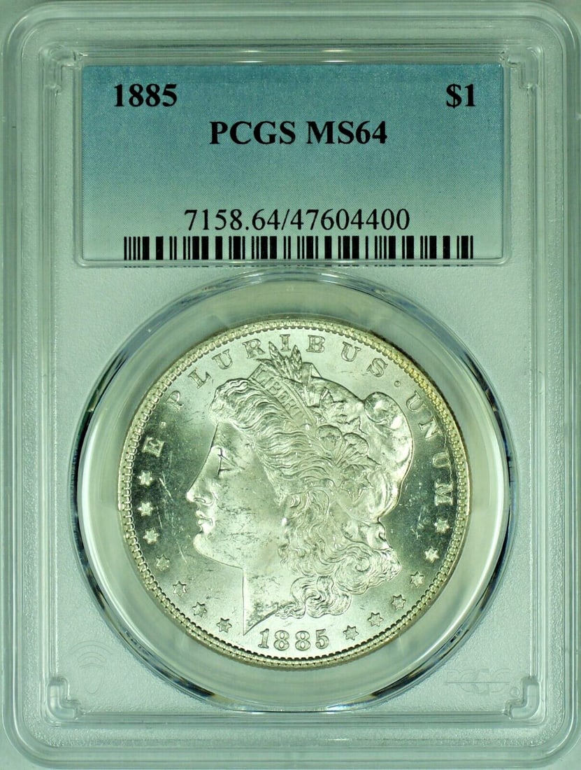PCGS MS 64 Morgan Dollar 1885 Silver Certified Coin: PCGS MS 64 Morgan Dollar 1885 Silver Certified Coin This 1885 Morgan Silver Dollar is certified by PCGS with a grade of MS 64. The coin is uncirculated and composed of silver. It originates from the U