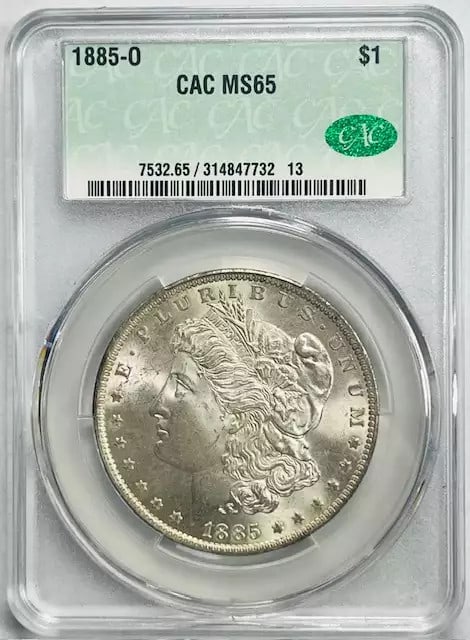 1885 O Morgan Silver Dollar CACG MS 65 Certified Silver Coin: 1885 O Morgan Silver Dollar CACG MS 65 Certified Silver Coin This is an 1885 O Morgan Silver Dollar, certified by CAC and graded MS 65. Struck in silver at the New Orleans Mint, this coin features a c