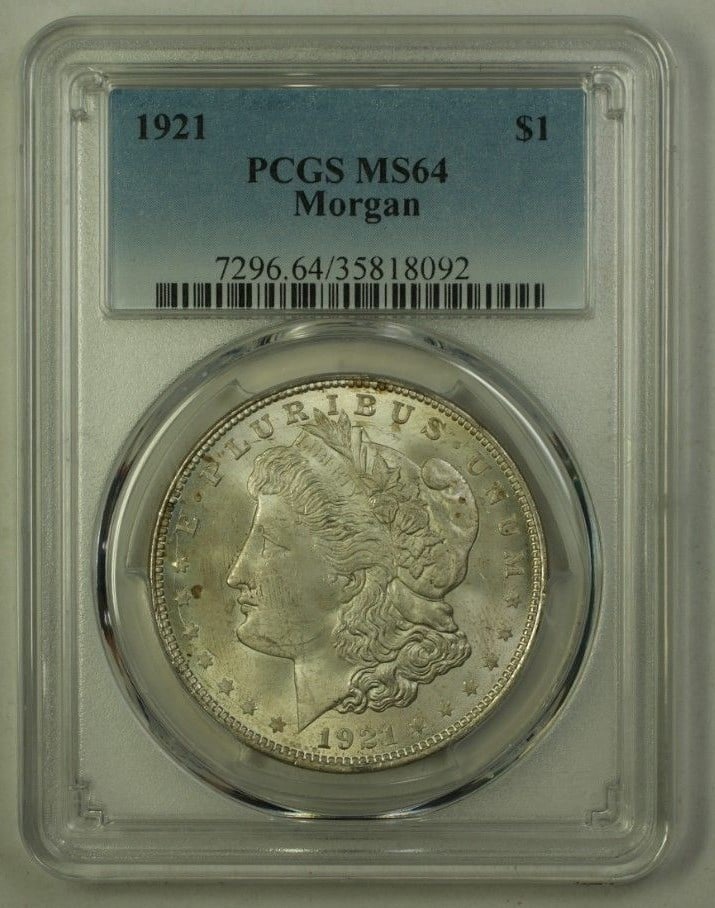1921 Morgan Dollar Silver $1 Philadelphia PCGS MS-64 Certified Coin: 1921 Morgan Dollar Silver $1 Philadelphia PCGS MS-64 Certified Coin This 1921 Morgan Silver Dollar is an uncirculated $1 coin certified by PCGS with a grade of MS-64. Minted in Philadelphia, it featur