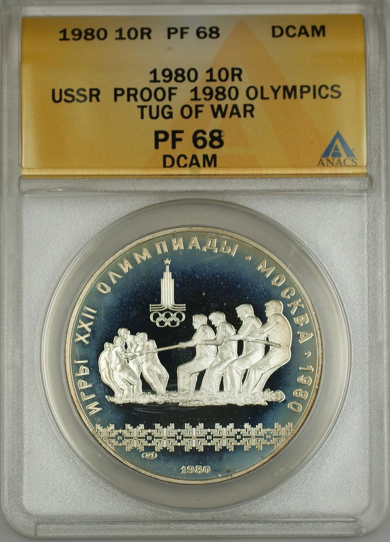 1980 ANACS PF 68 Silver 10 Ruble USSR Olympics Tug of War Proof Coin: 1980 ANACS PF 68 Silver 10 Ruble USSR Olympics Tug of War Proof Coin This 1980 USSR 10 Ruble silver coin commemorates the Olympics and features a tug of war design. It is a proof coin with a DCAM (Dee