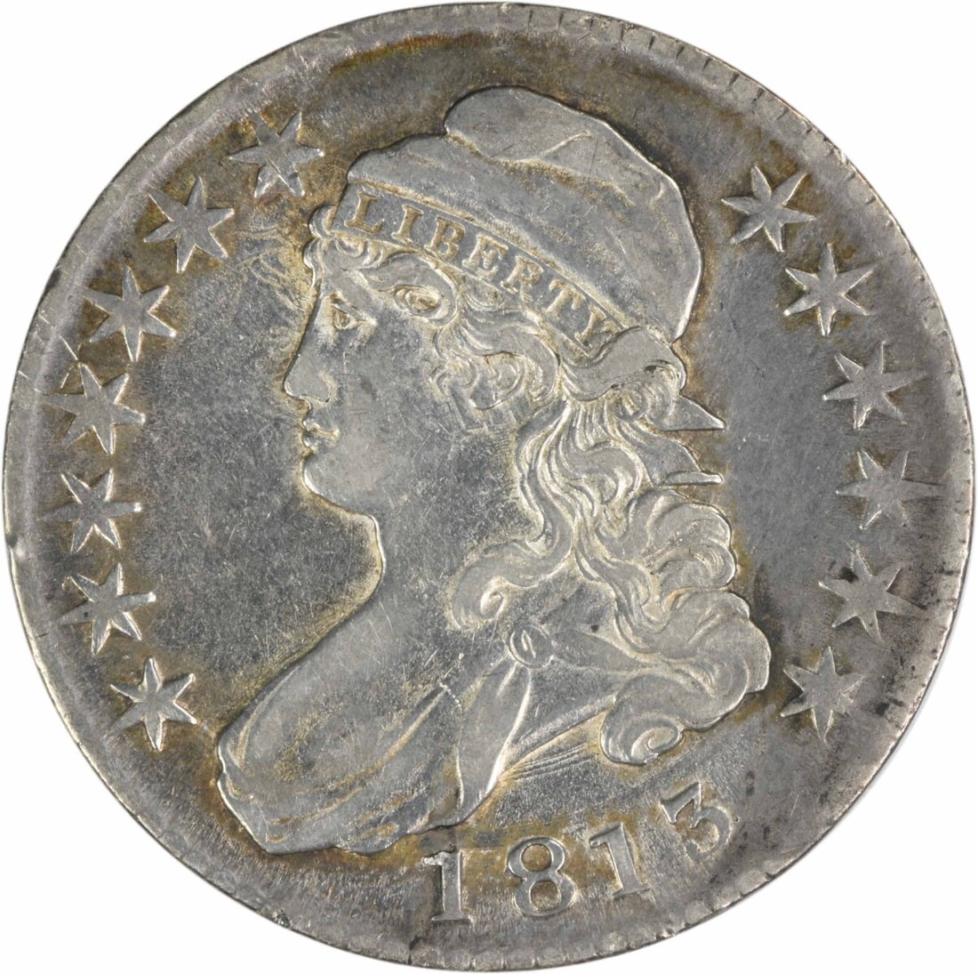 1813 Bust Half Dollar 50C John Reich Design Uncertified Silver Coin: 1813 Bust Half Dollar 50C John Reich Design Uncertified Silver Coin This 1813 Bust Half Dollar, with a denomination of 50 cents, showcases the craftsmanship of designer John Reich. Made from 89.2% sil