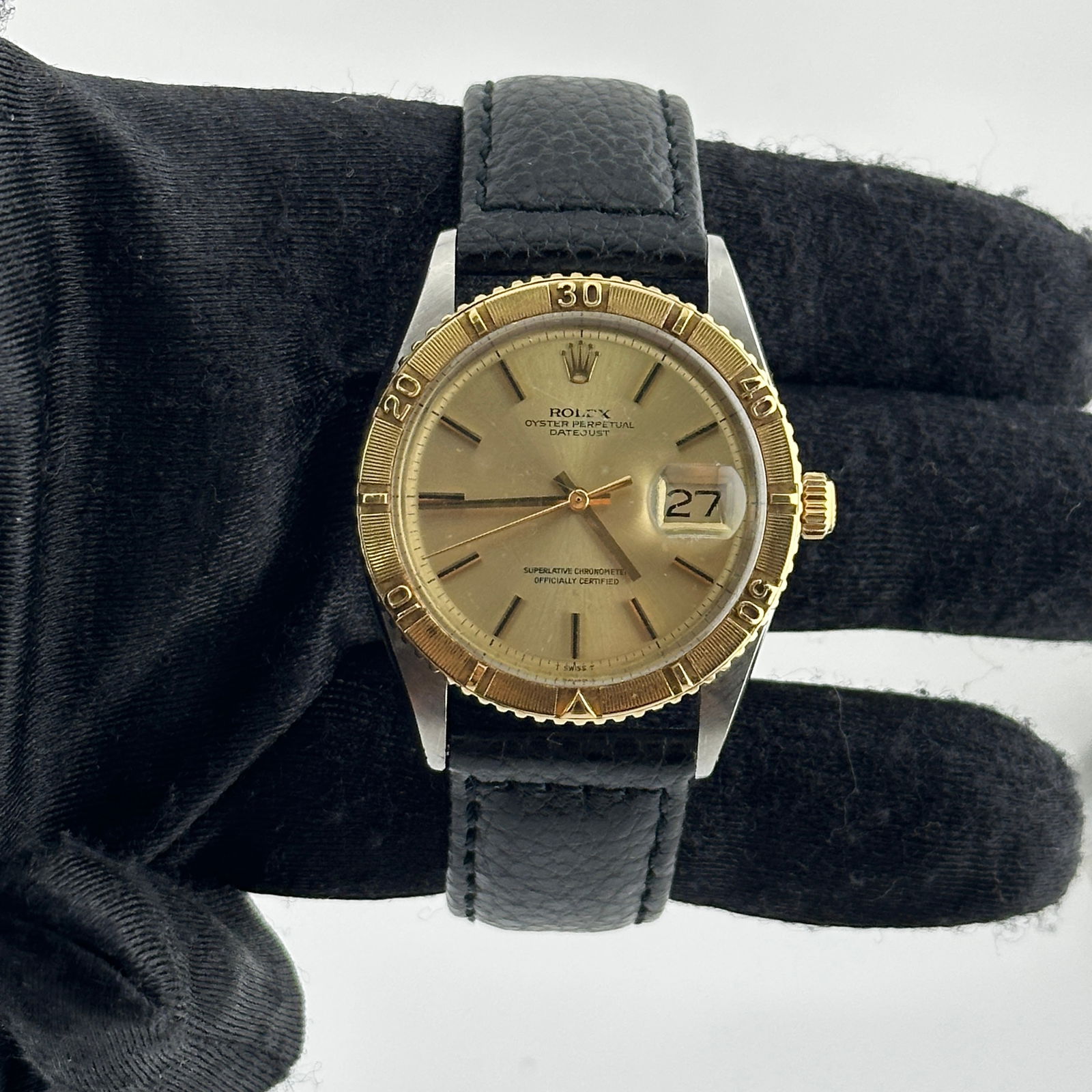 Datejust Ref 1625 Watch with Champagne Stick Dial on Aftermarket Leather: Datejust Ref 1625 Watch with Champagne Stick Dial on Aftermarket Leather This Rolex Datejust watch features a champagne stick dial and a Turn-o-Graph bezel. It comes with an aftermarket leather bracel