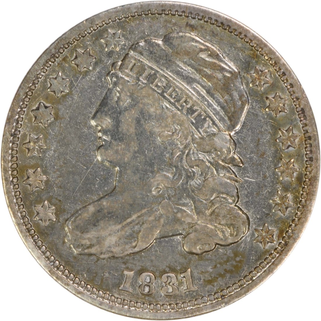 1831 Capped Bust Dime Philadelphia VF Grade Uncertified Silver Coin: 1831 Capped Bust Dime Philadelphia VF Grade Uncertified Silver Coin This 1831 Capped Bust silver dime from the United States features the classic design by John Reich and was minted in Philadelphia. C