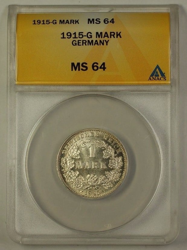 1915-G One Mark Silver Germany Coin Certified MS-64 by ANACS: 1915-G One Mark Silver Germany Coin Certified MS-64 by ANACS This is a 1915-G Germany One Mark silver coin, graded MS-64 by ANACS. The coin is uncirculated and composed of silver. It is a certified co