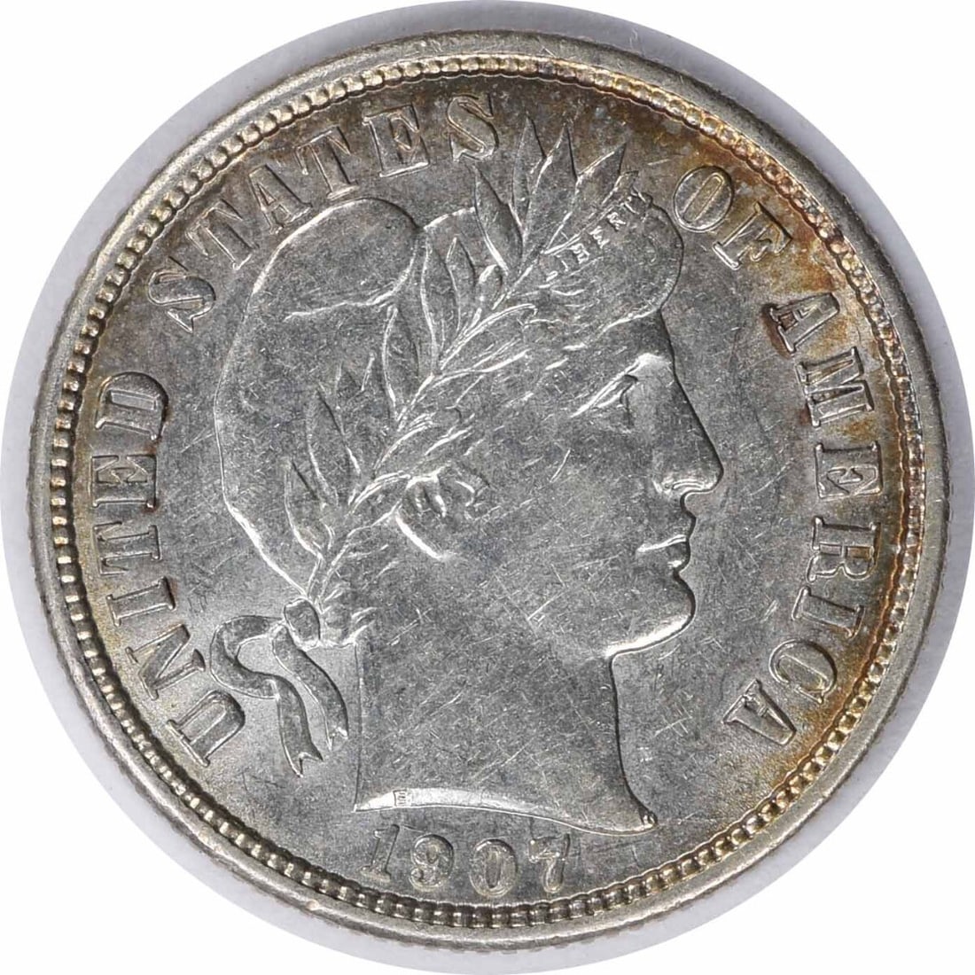 1907-S Barber Silver Dime 90% Silver AU by Charles E Barber: 1907-S Barber Silver Dime 90% Silver AU by Charles E Barber This 1907-S Barber Silver Dime features a composition of 90% silver and 10% copper, showcasing the exquisite design by Charles E. Barber. It