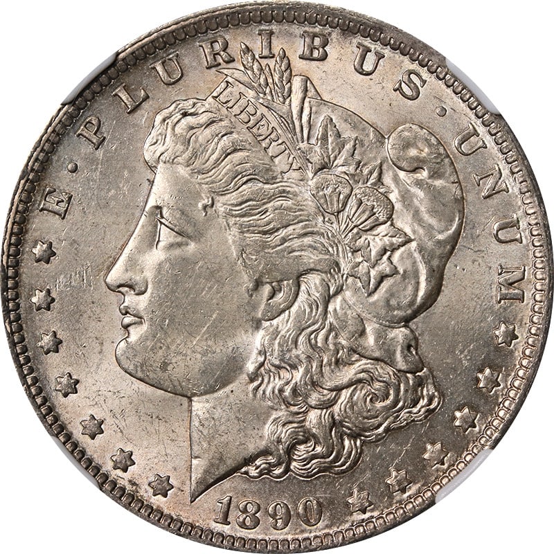 1890-O Morgan Silver Dollar NGC MS62 Uncirculated Silver Coin: 1890-O Morgan Silver Dollar NGC MS62 Uncirculated Silver Coin This 1890-O Morgan Silver Dollar is graded NGC MS62, showcasing decent eye appeal with an average strike. The coin features attractive col