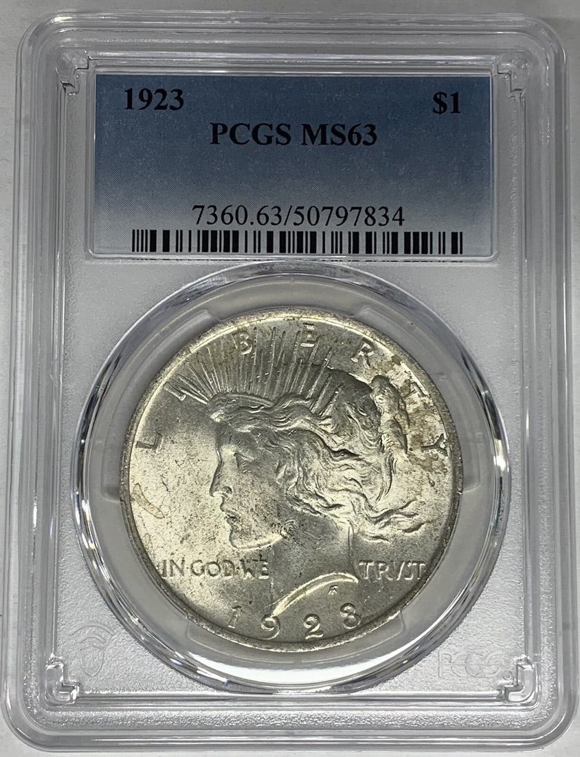 PCGS MS 63 1923 Peace Dollar Silver Coin Certified Uncirculated: PCGS MS 63 1923 Peace Dollar Silver Coin Certified Uncirculated This is a 1923 Peace Silver Dollar coin from the United States, certified by PCGS with a grade of MS 63. The coin is uncirculated and co