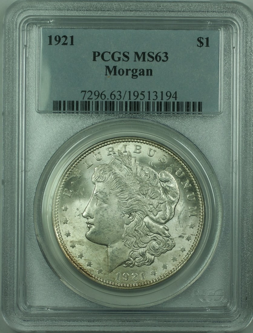 1921 $1 Morgan Silver Dollar PCGS MS63 Philadelphia Uncirculated: 1921 $1 Morgan Silver Dollar PCGS MS63 Philadelphia Uncirculated This is a 1921 Morgan Silver Dollar from the United States, certified by PCGS with a grade of MS-63. The coin is uncirculated and compo