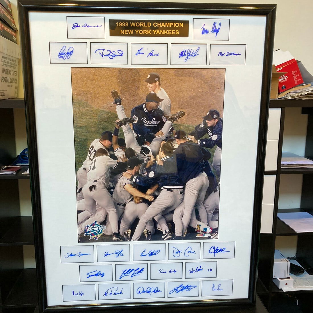 1998 New York Yankees Team Signed Display with Derek Jeter JSA Authenticated: 1998 New York Yankees Team Signed Display with Derek Jeter JSA Authenticated Celebrate the legendary 1998 New York Yankees with this stunning team-signed display featuring 21 autographs, including bas