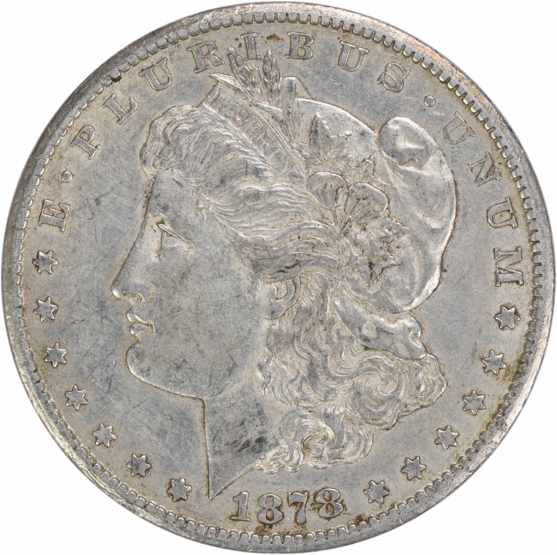 1878 CC Morgan Silver Dollar AU Uncertified 90% Silver Coin: 1878 CC Morgan Silver Dollar AU Uncertified 90% Silver Coin This 1878-CC Morgan Silver Dollar is a remarkable collectible coin, featuring a design by George T. Morgan. It is made of 90% silver and 10%