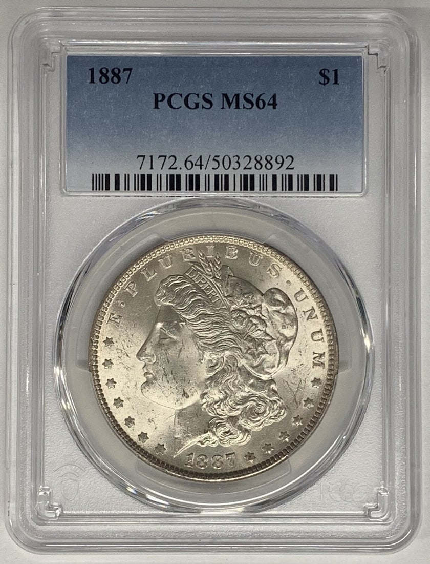 PCGS MS64 Certified 1887 Silver Morgan Dollar Coin: PCGS MS64 Certified 1887 Silver Morgan Dollar Coin This 1887 Morgan Silver Dollar is an uncirculated coin graded MS 64 by PCGS. It is composed of silver, issued in the United States with a denominatio