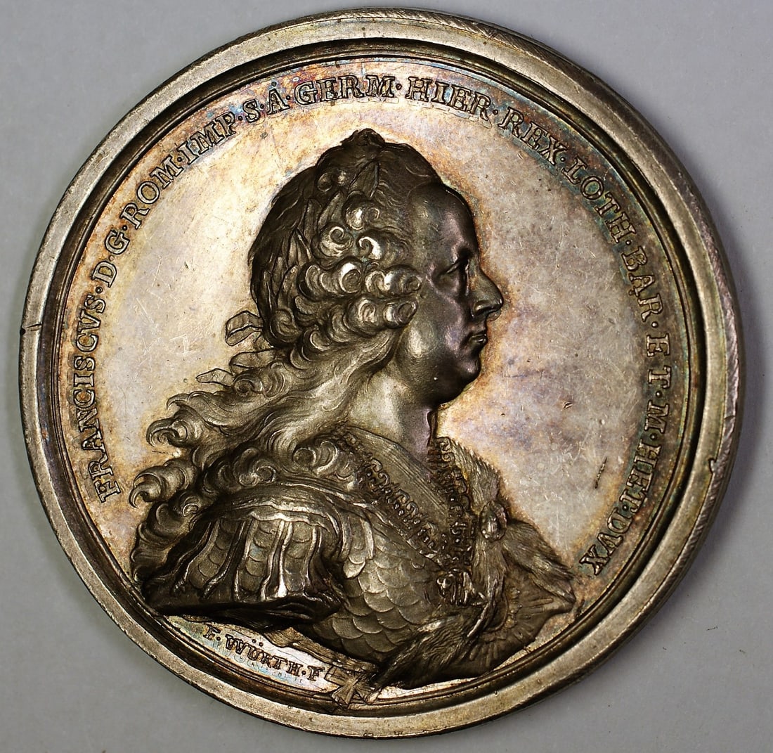 Silver High Relief Maria Theresa Francis Medal Sculpted by Wurth with Toned Finish: Silver High Relief Maria Theresa Francis Medal Sculpted by Wurth with Toned Finish This is a Maria Theresa Francis high relief medal sculpted by Wurth. Crafted from silver, the medal features attracti