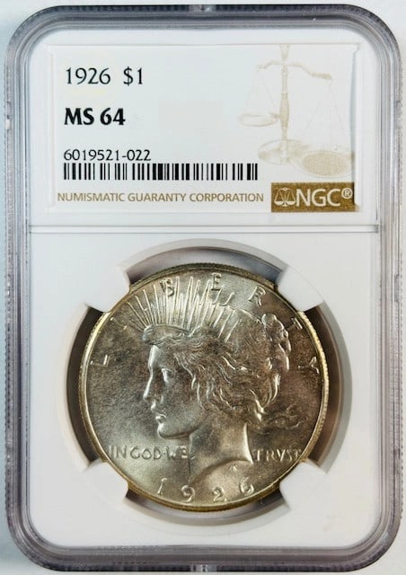 1926 Silver Peace Dollar Graded MS64 by NGC: 1926 Silver Peace Dollar Graded MS64 by NGC This 1926 Peace Dollar is certified by NGC with a grade of MS 64. Composed of silver, it is uncirculated and originates from the USA. The coin is pre-owned