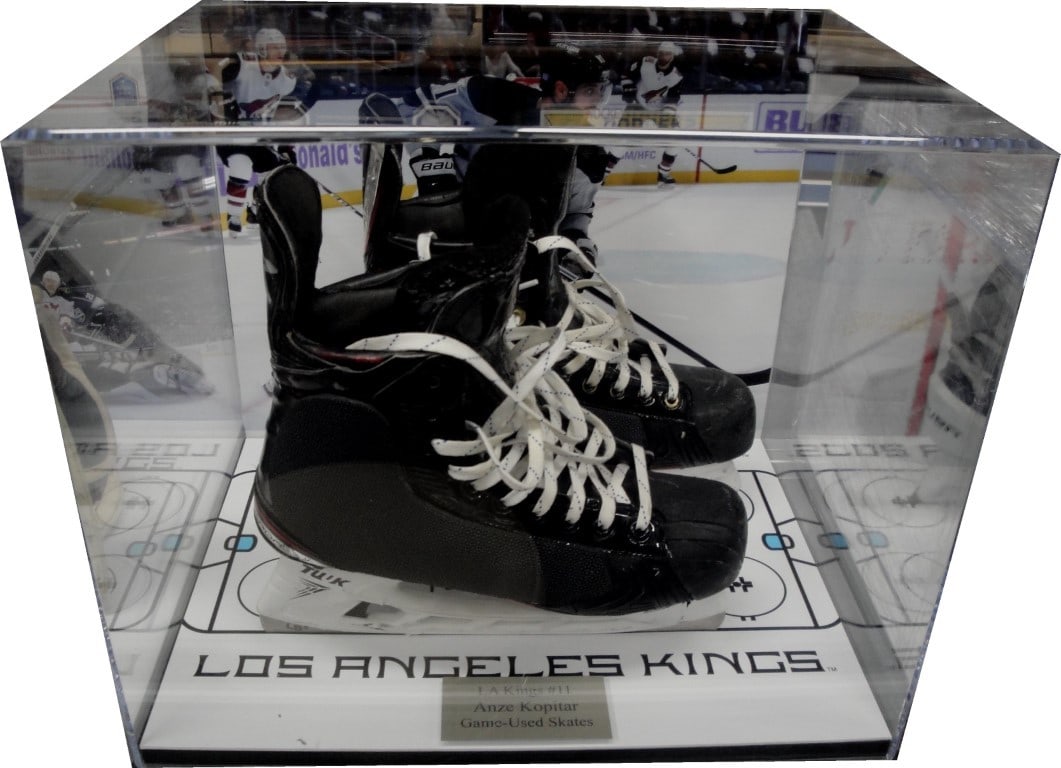 Anze Kopitar Game Used Skates in Framed Kings Shadowbox: Anze Kopitar Game Used Skates in Framed Kings Shadowbox Celebrate the legacy of Anze Kopitar with these game-used skates, beautifully framed in a stylish Los Angeles Kings shadowbox. This unique displ