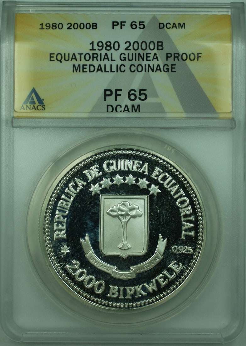 Equatorial Guinea 1980 2000 Bipkwele Silver Proof Medal ANACS PF-65 DCAM: Equatorial Guinea 1980 2000 Bipkwele Silver Proof Medal ANACS PF-65 DCAM This 1980 Equatorial Guinea proof sterling silver medal commemorates the Spanish Royal Visit and features a 2000 Bipkwele denom