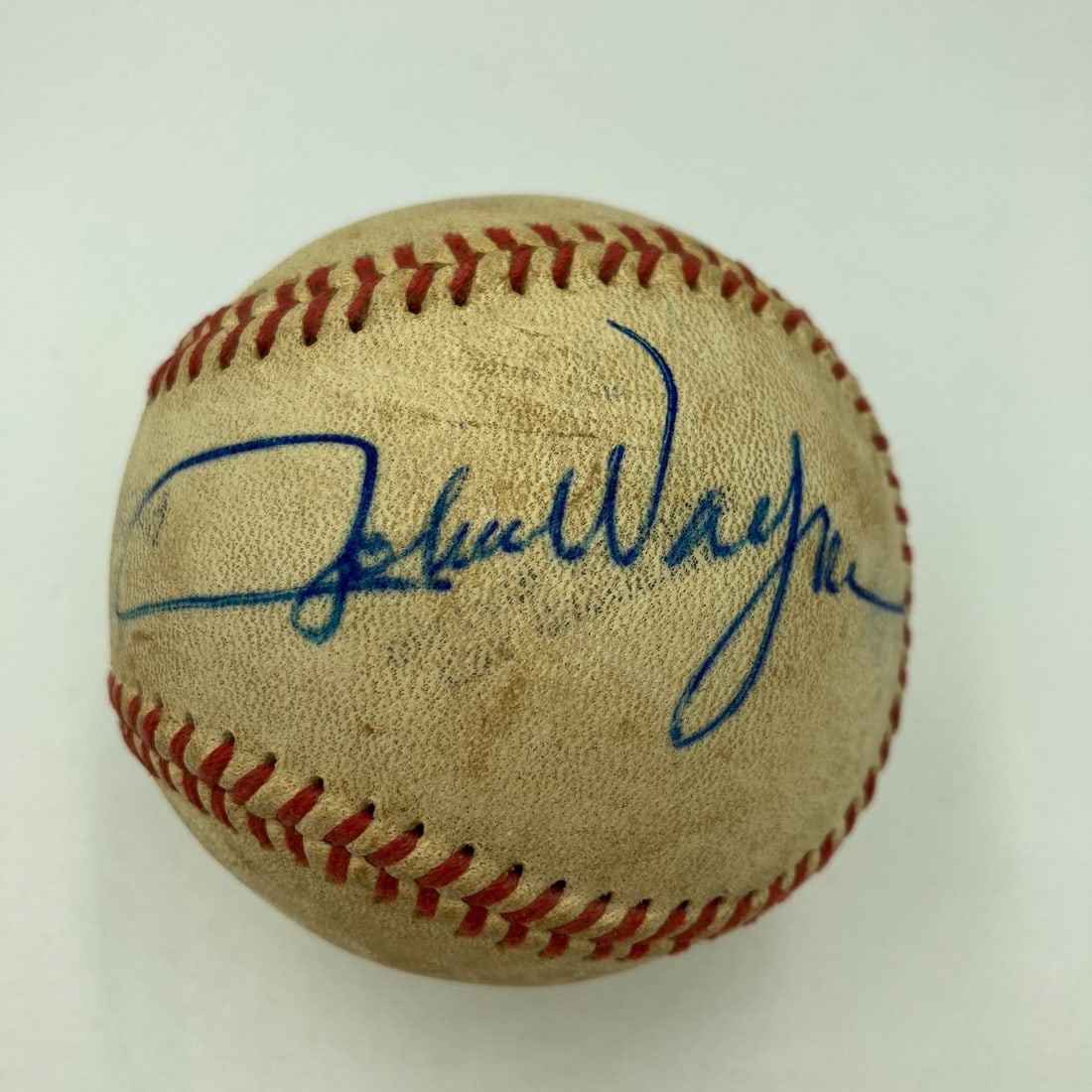 John Wayne Signed First Pitch Baseball with JSA COA: John Wayne Signed First Pitch Baseball with JSA COA This unique collectible features a single signed official Pacific Coast League baseball by the legendary actor John Wayne. The ball comes with impec