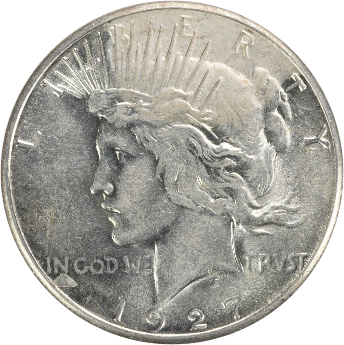 1927-S Peace Silver Dollar AU Uncertified 90% Silver Coin: 1927-S Peace Silver Dollar AU Uncertified 90% Silver Coin This 1927-S Peace Silver Dollar is an exquisite piece of numismatic history, showcasing the artistry of designer Anthony de Francisci. With a