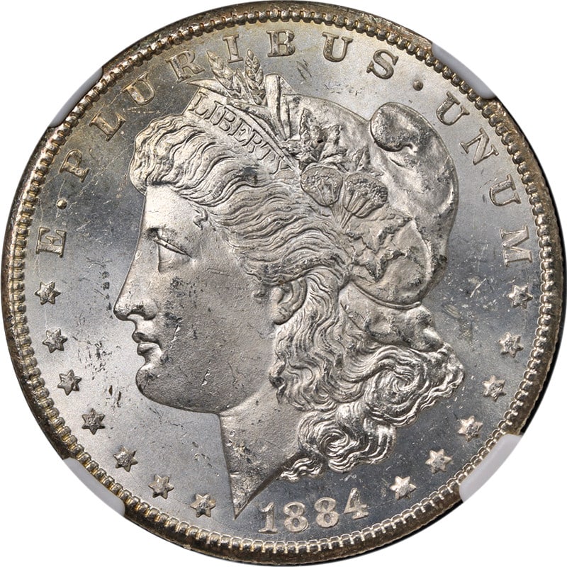 1884-CC Morgan Silver Dollar NGC MS63 Exceptional Eye Appeal: 1884-CC Morgan Silver Dollar NGC MS63 Exceptional Eye Appeal Introducing the stunning 1884-CC Morgan Silver Dollar, certified by NGC with a grade of MS63. This coin features exceptional eye appeal, sh