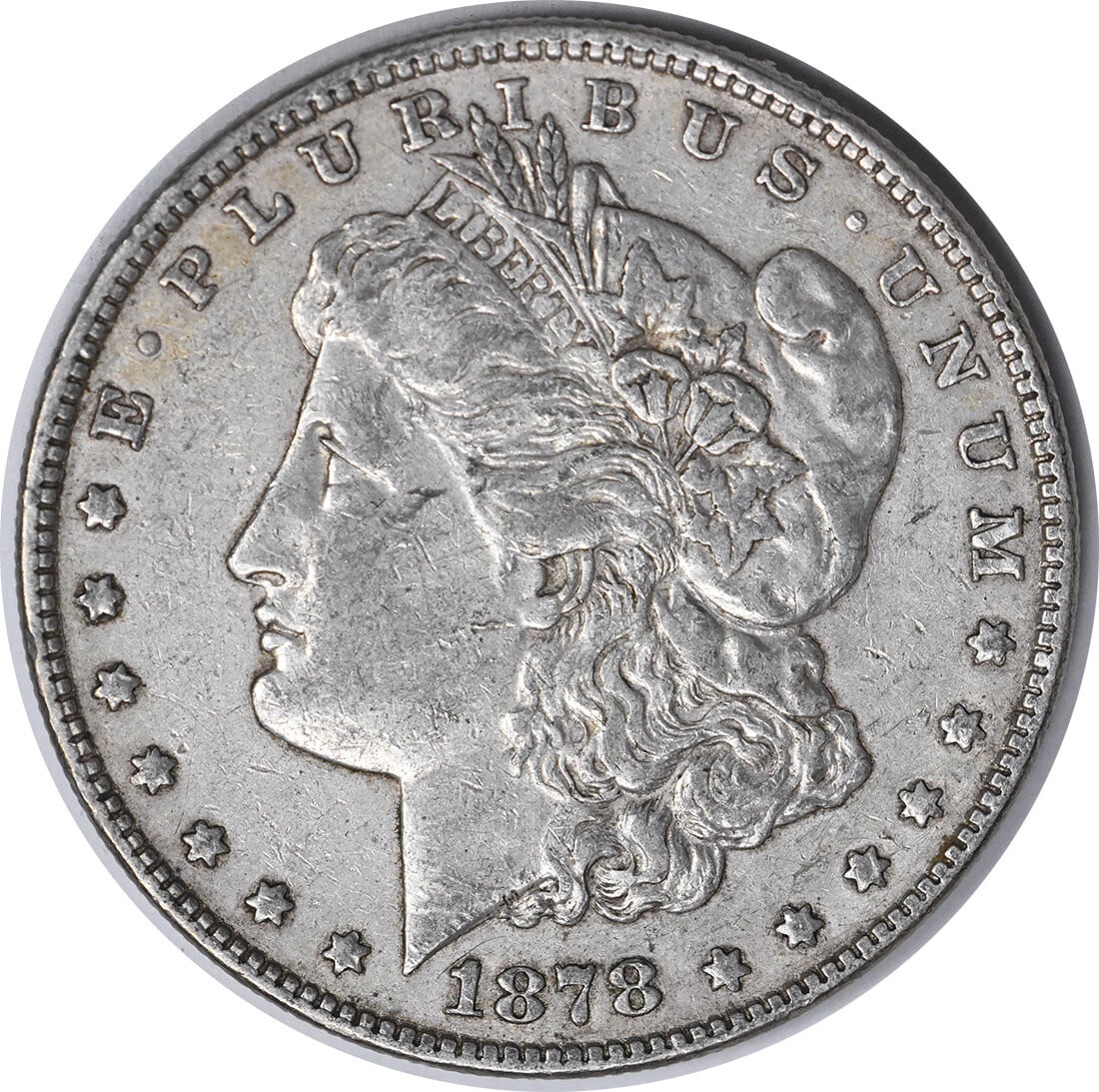 1878 Morgan Silver Dollar VAM 168 90% Silver Uncertified: 1878 Morgan Silver Dollar VAM 168 90% Silver Uncertified This 1878 Morgan Silver Dollar, featuring the VAM 168 variety, is a remarkable piece of numismatic history. Designed by George T. Morgan, this