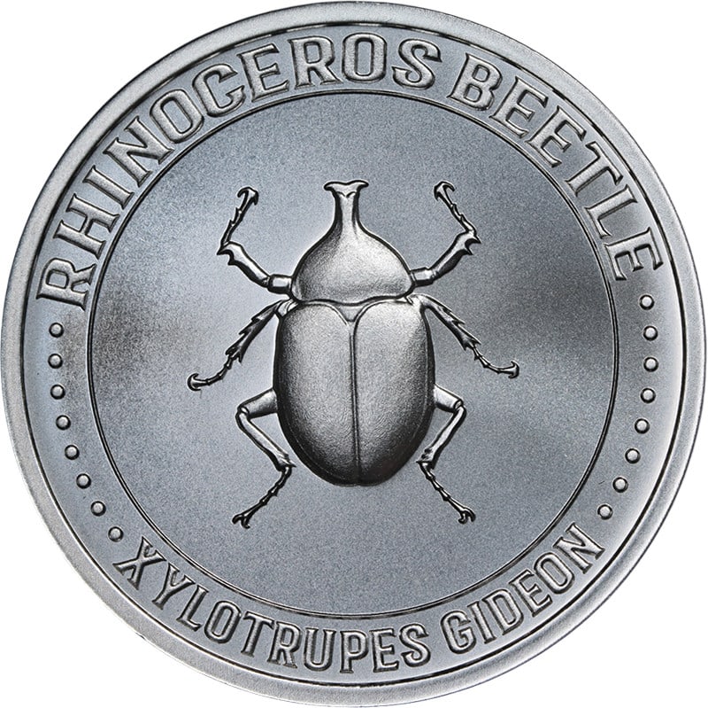 Rhinoceros Beetle 1 oz Silver Coin by Intaglio Mint with OGP and COA: Rhinoceros Beetle 1 oz Silver Coin by Intaglio Mint with OGP and COA This Intaglio Mint 1 ounce silver coin features a rhinoceros beetle design. The coin is struck in 0.999 fine silver and comes in or