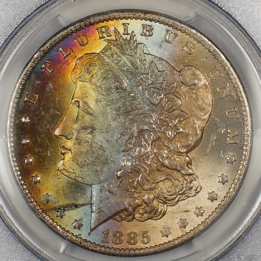 PCGS MS63 1885-O Silver Dollar with Attractive Obverse Toning: PCGS MS63 1885-O Silver Dollar with Attractive Obverse Toning This 1885-O Morgan Silver Dollar features a beautifully toned obverse and has been certified by PCGS with a grade of MS-63. Minted in New