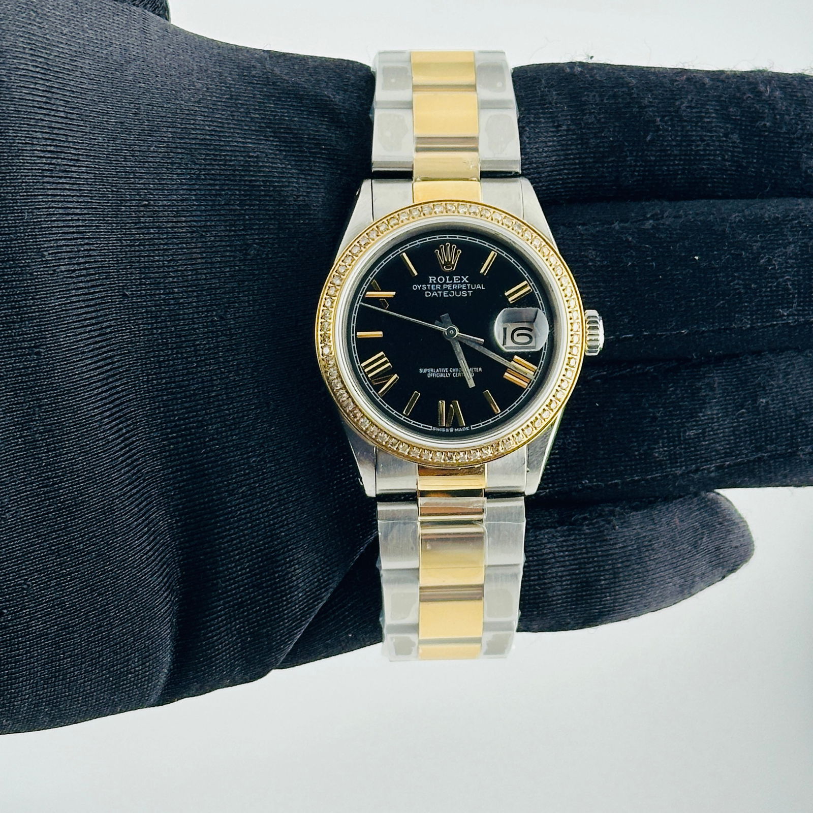 Rolex Datejust Ref 1603 Mens Watch With Aftermarket Black Roman Dial: Rolex Datejust Ref 1603 Mens Watch With Aftermarket Black Roman Dial This Rolex Datejust features an aftermarket black dial with Roman and stick hour markers, set within an aftermarket Oyster bracelet
