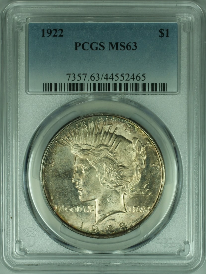 PCGS MS63 1922 Peace Dollar Silver Coin with Attractive Toning: PCGS MS63 1922 Peace Dollar Silver Coin with Attractive Toning This 1922 Peace Silver Dollar was minted in Philadelphia and is certified by PCGS with a grade of MS-63. The uncirculated coin features a